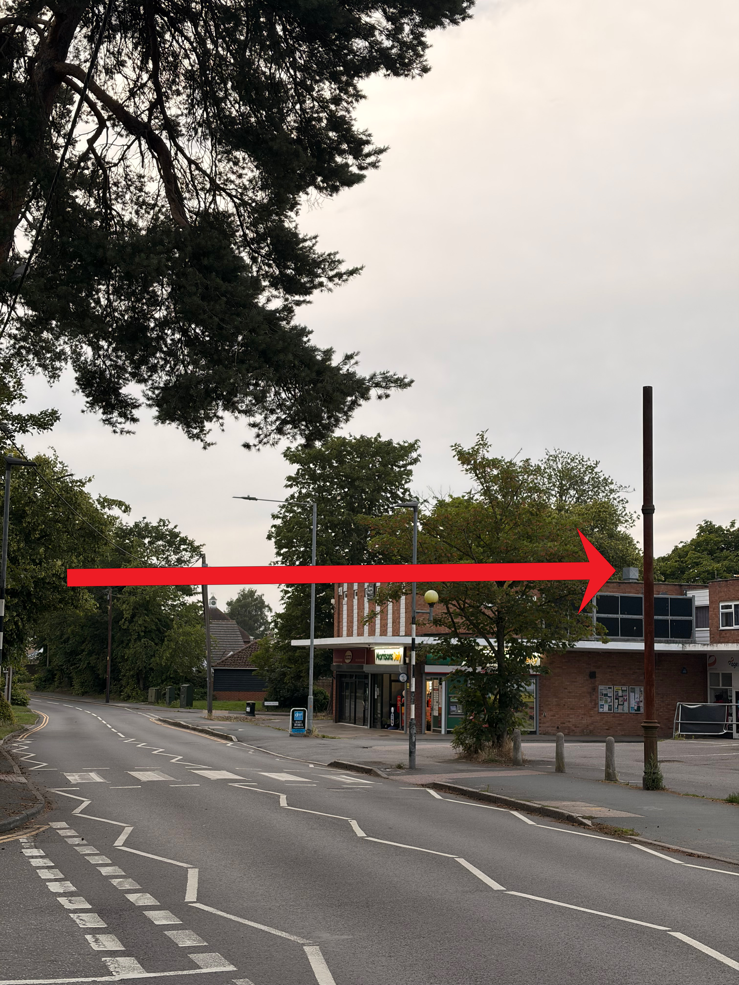 The Victorian stink pipe standing tall on Church Road, Tiptree, beside the Morrisons Daily
